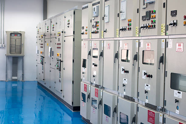 A room with numerous electrical panels and switches, part of the infrastructure pipeline.